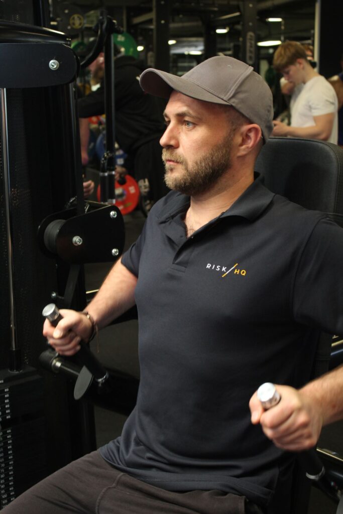 RiskHQ health and safety consultant using gym equipment in a fitness facility